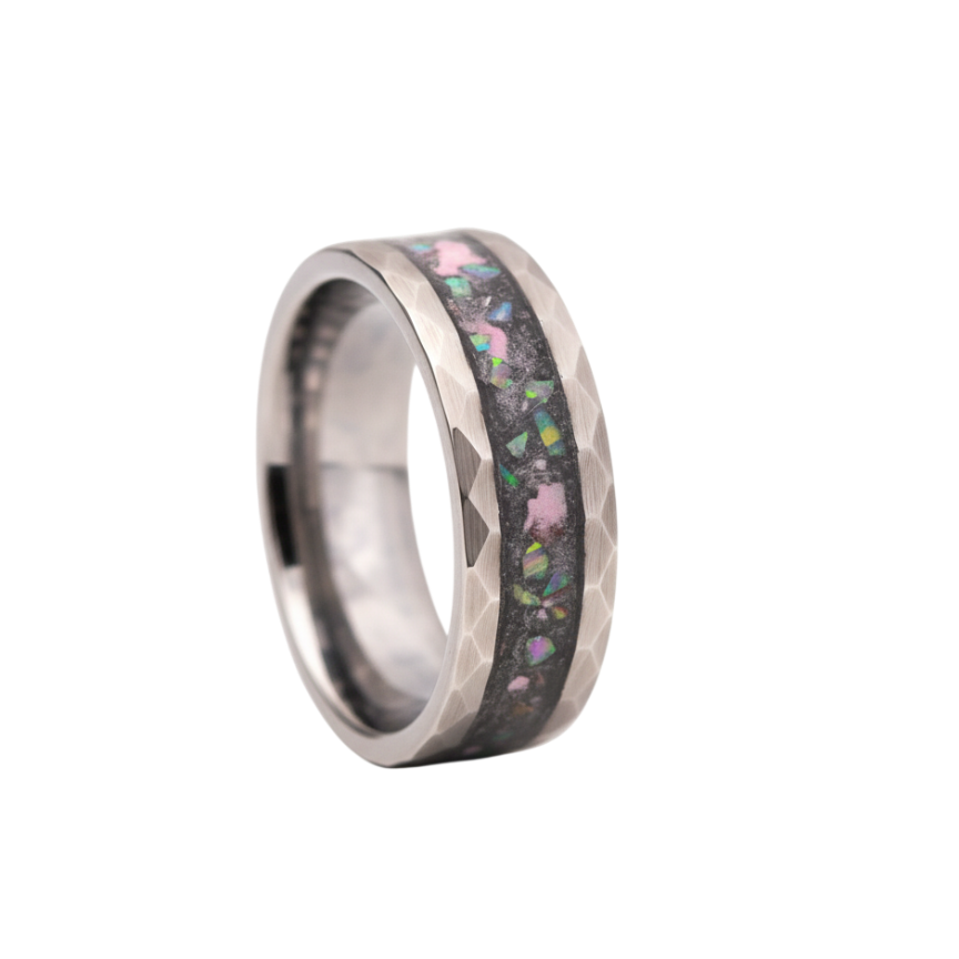 Silver ring with multicolored inlay on a white background